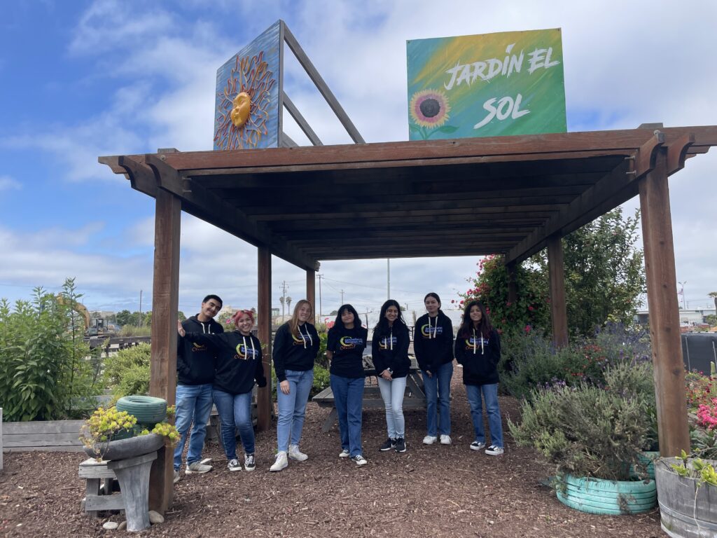 Youth Council under awning in Jardín el Sol