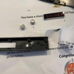 Junk mail e-waste opened up to show batteries